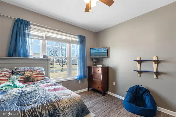 a bed room with a bed and a window