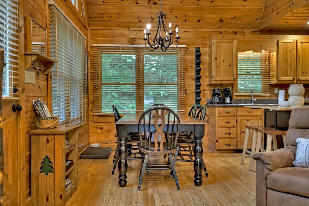 548 Mountain Highlands Court Blue Ridge, GA 30513 - Photo 12 of 33 a view of a dining room with furniture window and outside view