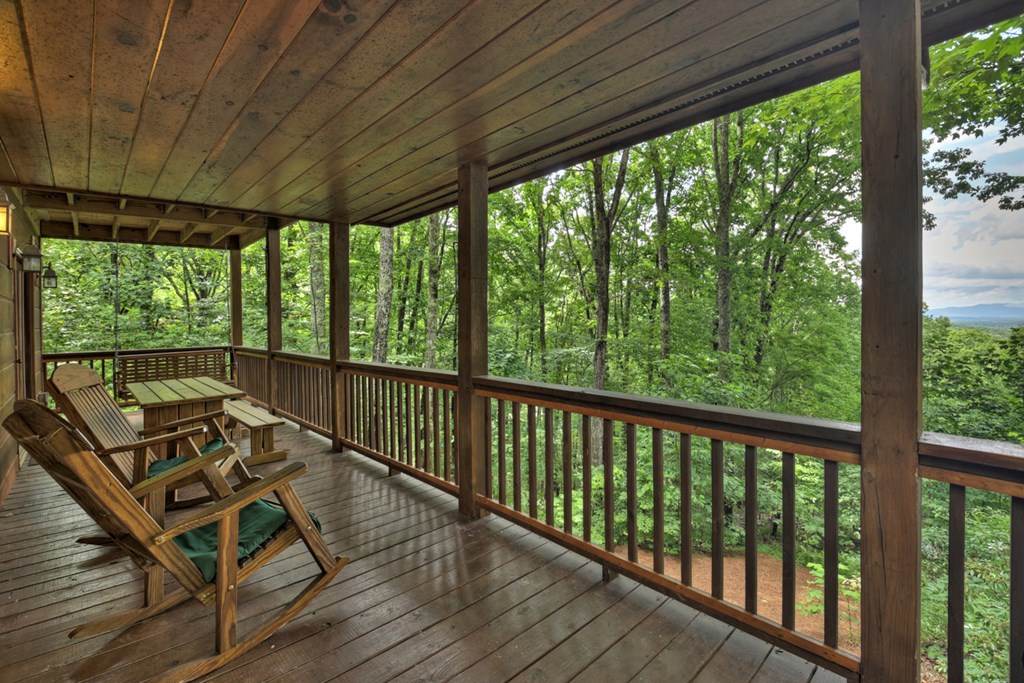 548 Mountain Highlands Court Blue Ridge, GA 30513 - Photo 9 of 33 a view of balcony with wooden floor and outdoor seating