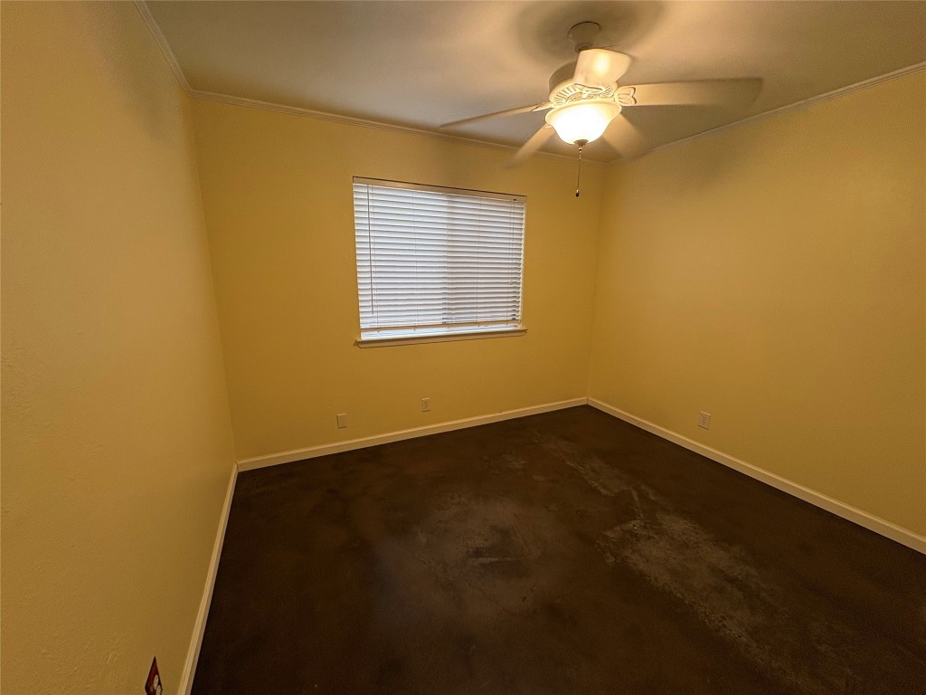 8713 Clearbrook Trail, Unit A Austin, TX 78729 - Photo 12 of 22 a view of an empty room with a window