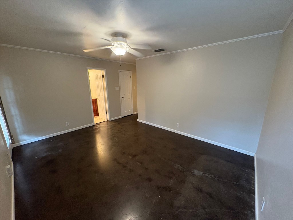 8713 Clearbrook Trail, Unit A Austin, TX 78729 - Photo 16 of 22 an empty room with wooden floor and windows