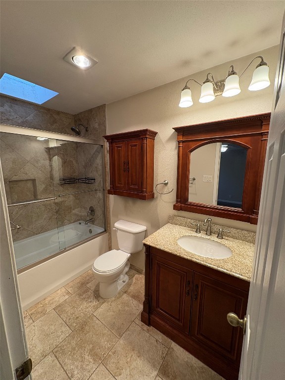 8713 Clearbrook Trail, Unit A Austin, TX 78729 - Photo 19 of 22 a bathroom with a sink vanity granite toilet and a mirror