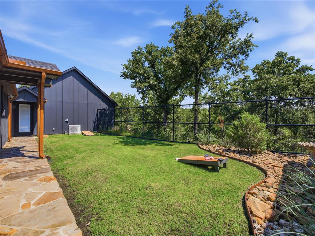 117 Ranchview Court Bowie, TX 76230 - Photo 27 of 40 a garden view with a seating space