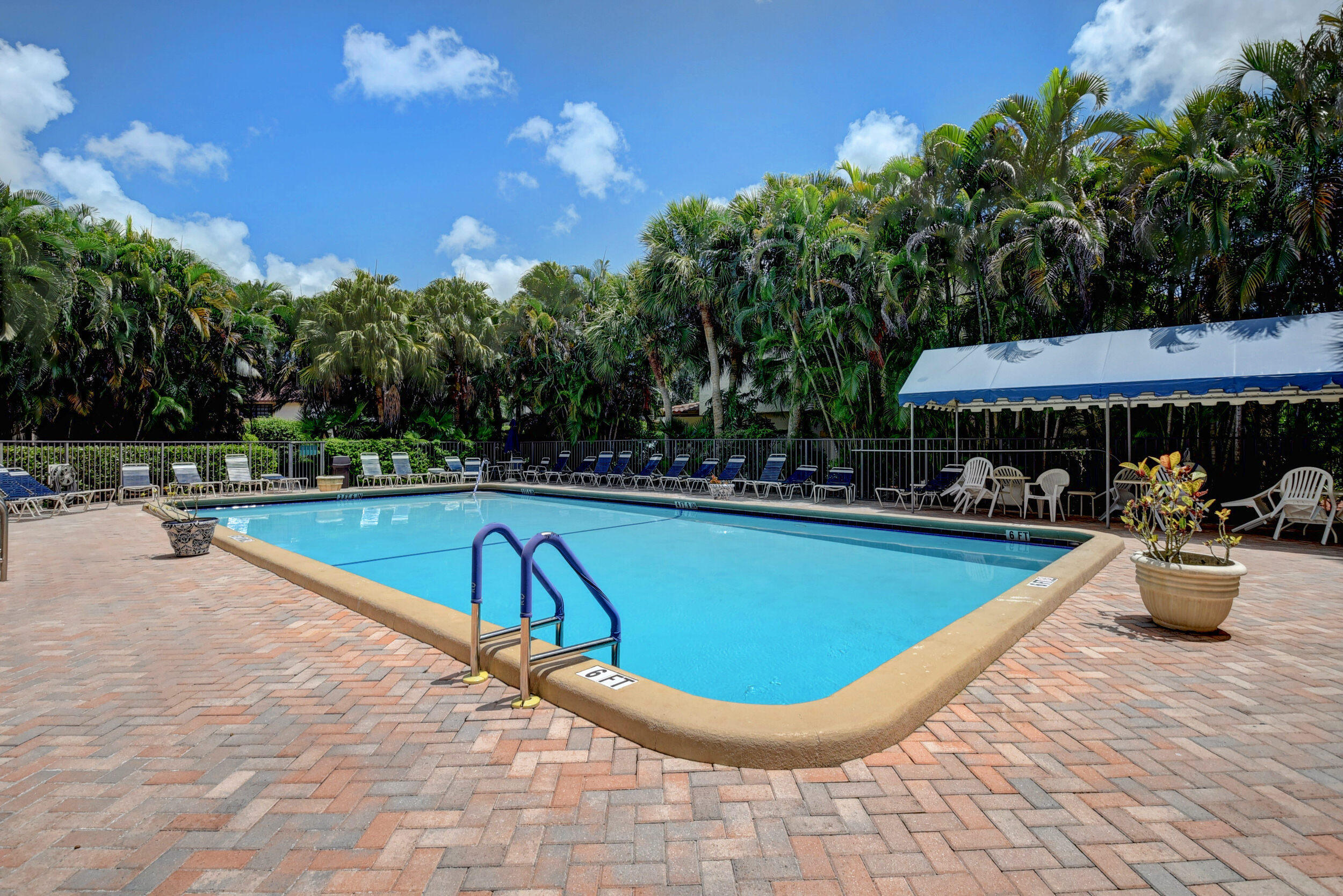7875 La Mirada Drive Boca Raton, FL 33433 - Photo 26 of 31 a view of a swimming pool and lounge chairs