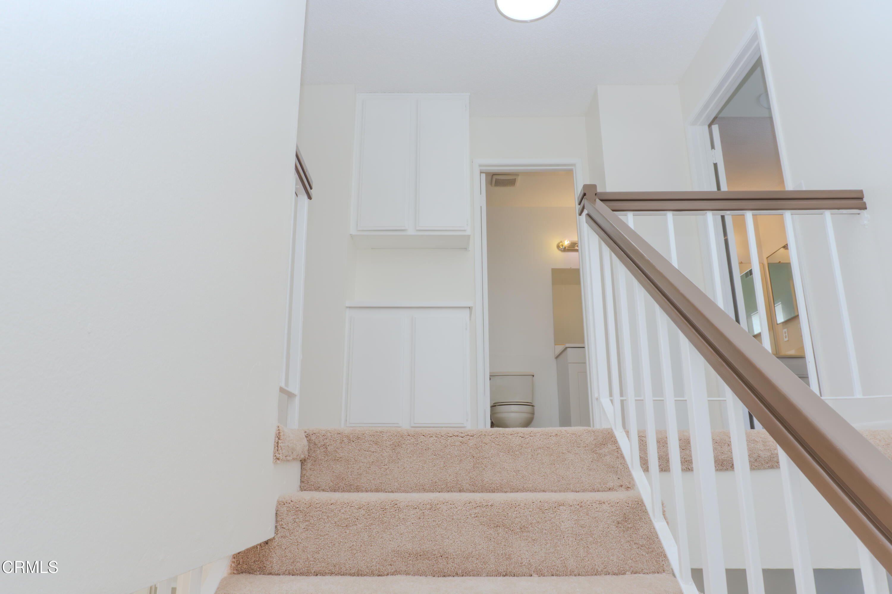 5313 Perkins Road Oxnard, CA 93033 - Photo 15 of 40 a view of staircase with wooden floor and stairs