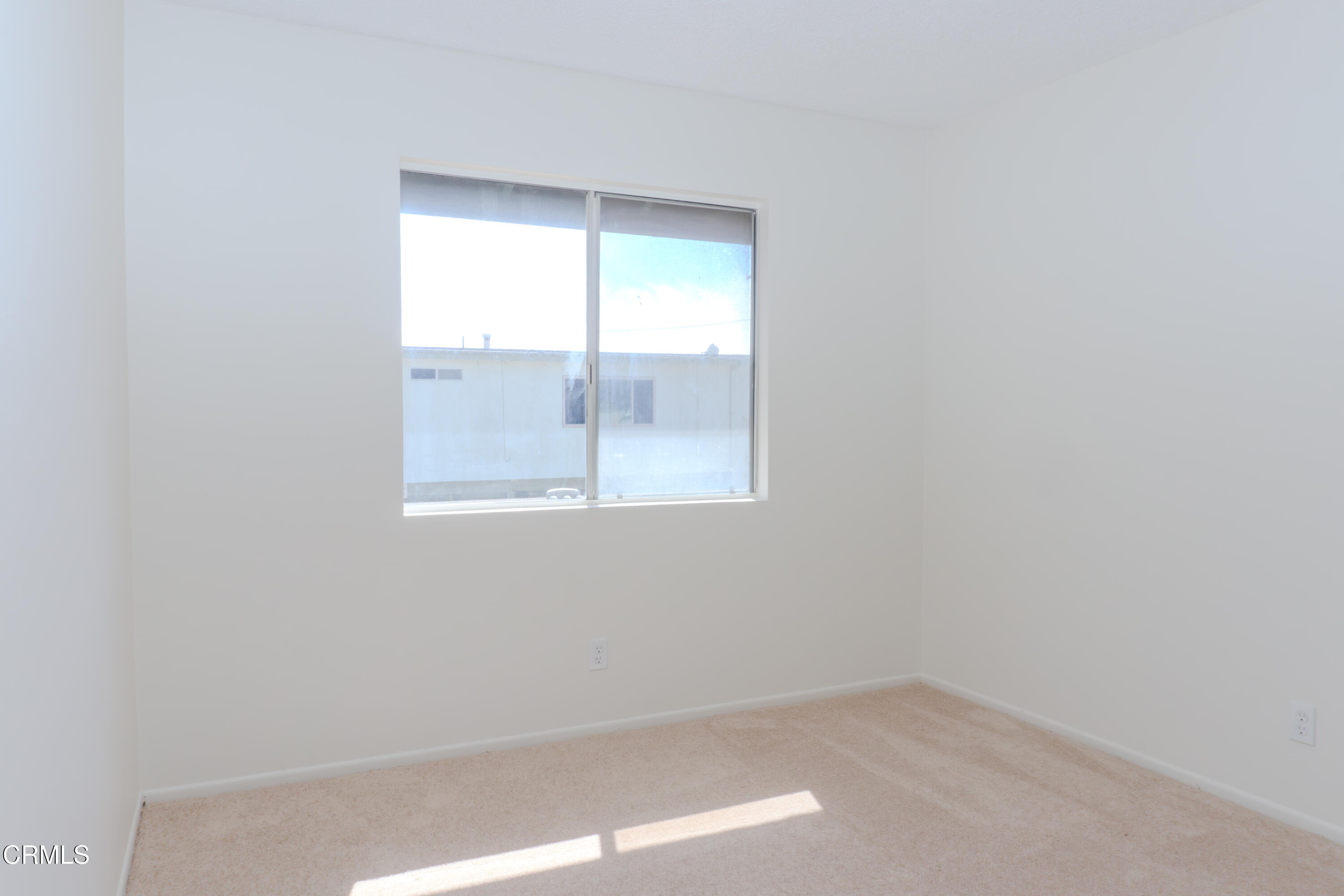 5313 Perkins Road Oxnard, CA 93033 - Photo 33 of 40 an empty room with a window