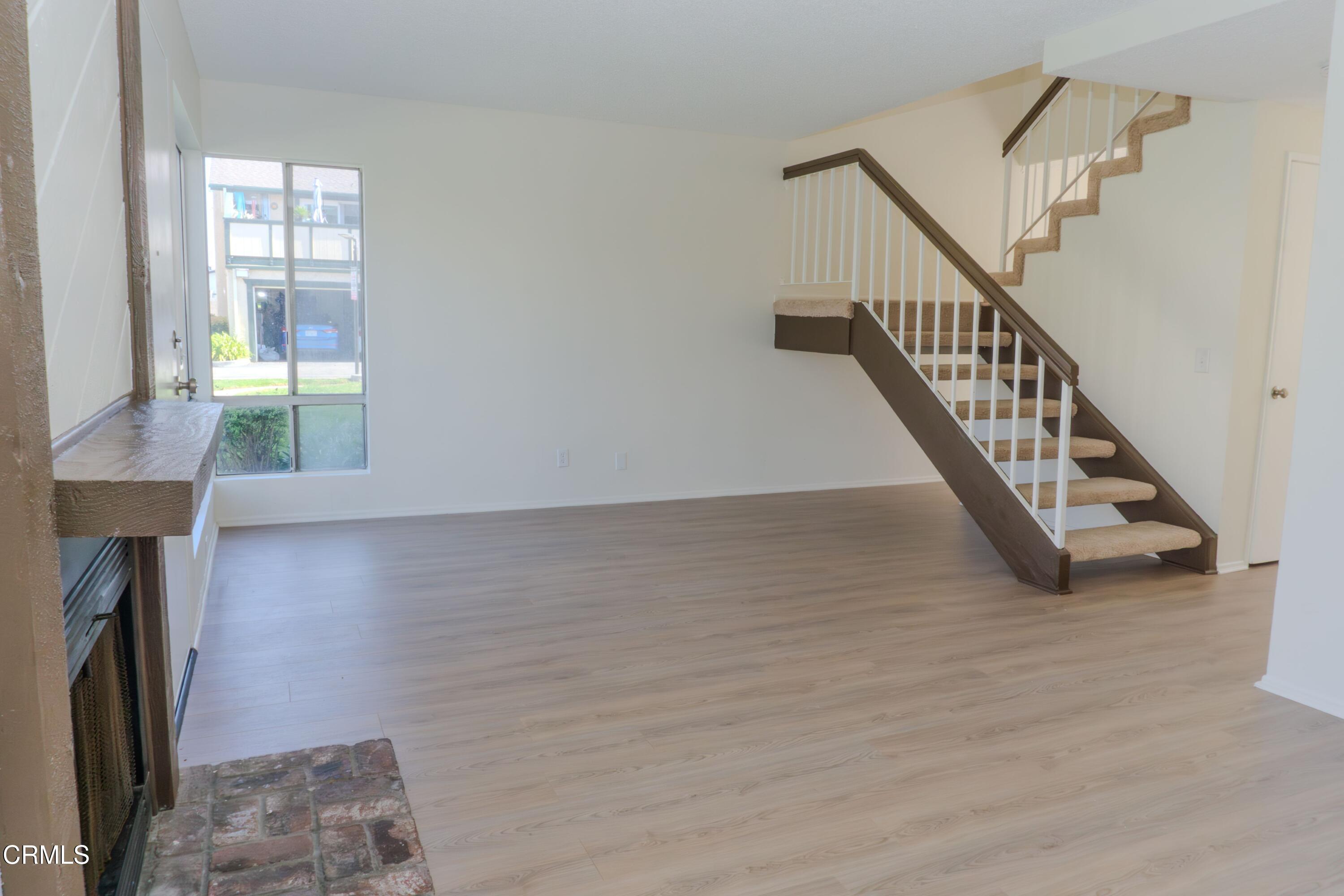 5313 Perkins Road Oxnard, CA 93033 - Photo 4 of 40 a view of entryway and hall with wooden floor