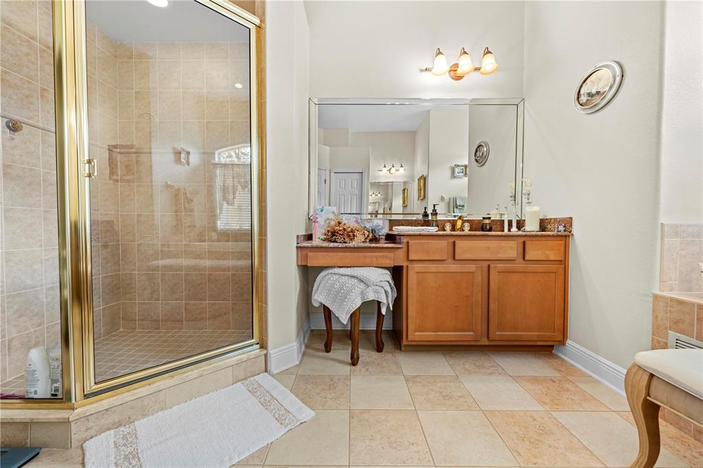 1245 Coble Road Spring Hill, FL 34608 - Photo 19 of 50 a view of a bathroom with mirror and shower