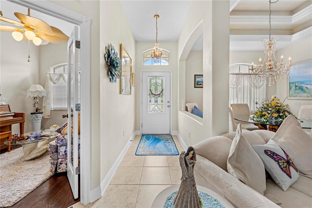 1245 Coble Road Spring Hill, FL 34608 - Photo 22 of 50 a living room with furniture and a chandelier