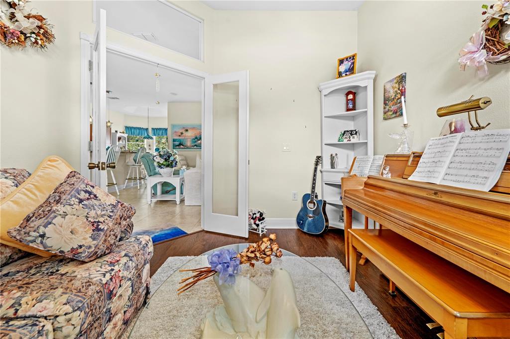 1245 Coble Road Spring Hill, FL 34608 - Photo 24 of 50 a bedroom with furniture and a wooden floor