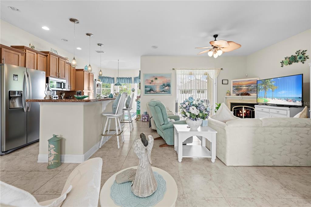 1245 Coble Road Spring Hill, FL 34608 - Photo 26 of 50 a living room with furniture kitchen view and a large window