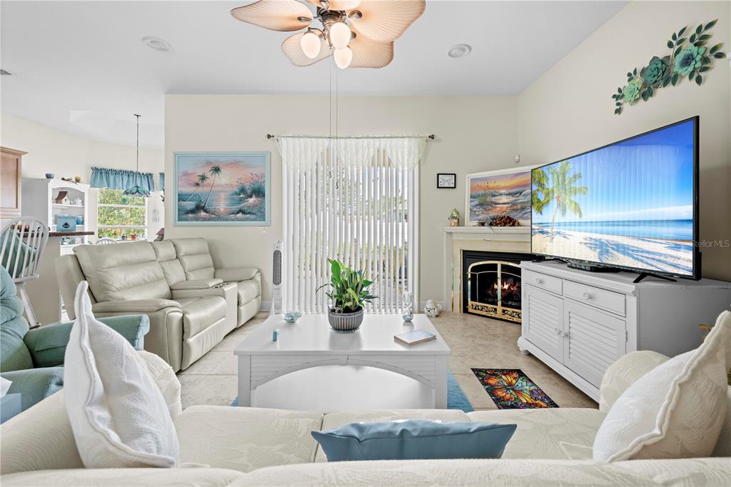 1245 Coble Road Spring Hill, FL 34608 - Photo 27 of 50 a living room with furniture and a flat screen tv