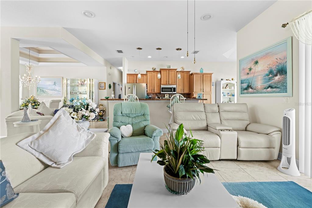 1245 Coble Road Spring Hill, FL 34608 - Photo 29 of 50 a living room with furniture and a painting