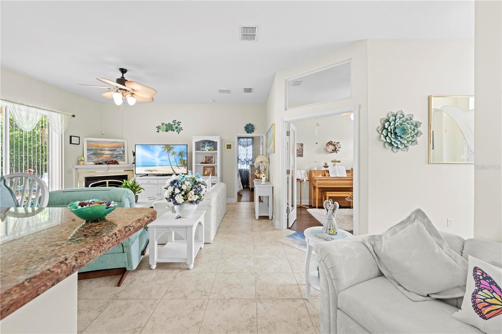 1245 Coble Road Spring Hill, FL 34608 - Photo 37 of 50 a living room with furniture and wooden floor
