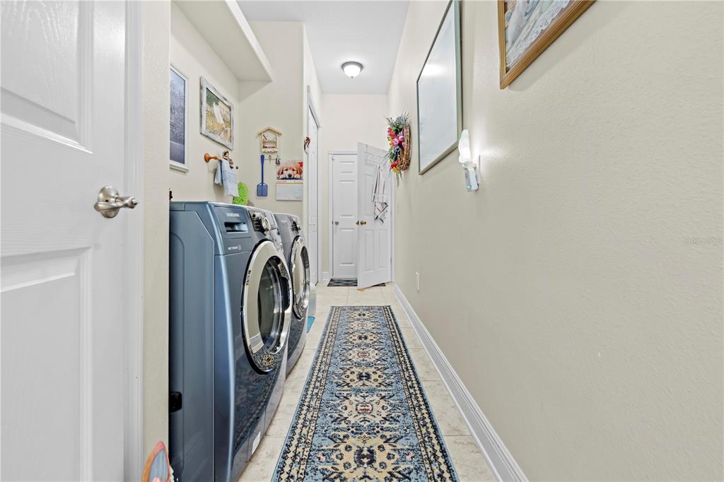 1245 Coble Road Spring Hill, FL 34608 - Photo 41 of 50 a view of hallway with washer and dryer