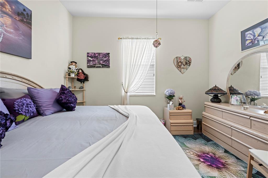 1245 Coble Road Spring Hill, FL 34608 - Photo 44 of 50 a bed room with a bed and a couch