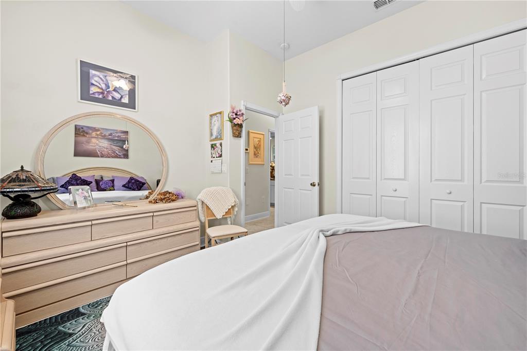 1245 Coble Road Spring Hill, FL 34608 - Photo 45 of 50 a bedroom with a bed and a cabinet