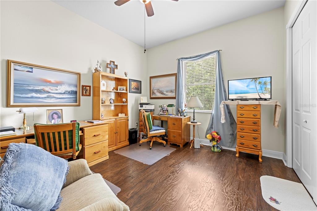 1245 Coble Road Spring Hill, FL 34608 - Photo 46 of 50 a bedroom with furniture and a window