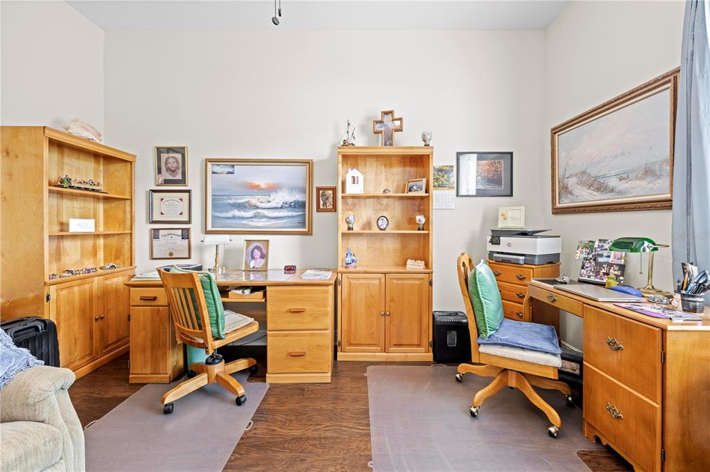 1245 Coble Road Spring Hill, FL 34608 - Photo 47 of 50 a view of a workspace with furniture and a window