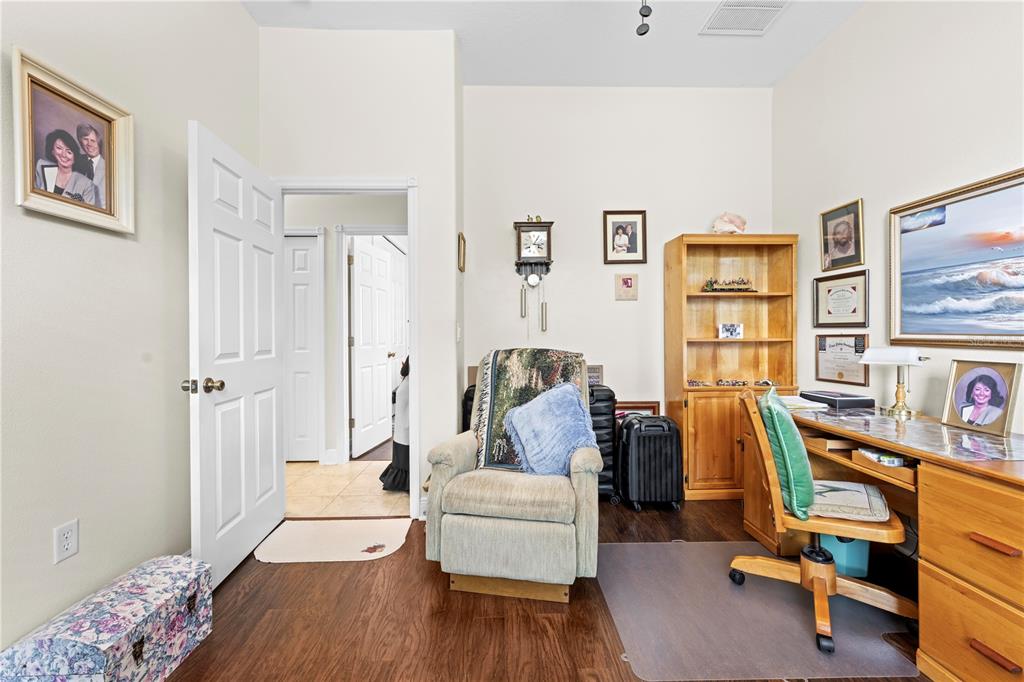 1245 Coble Road Spring Hill, FL 34608 - Photo 48 of 50 a living room with furniture and a flat screen tv