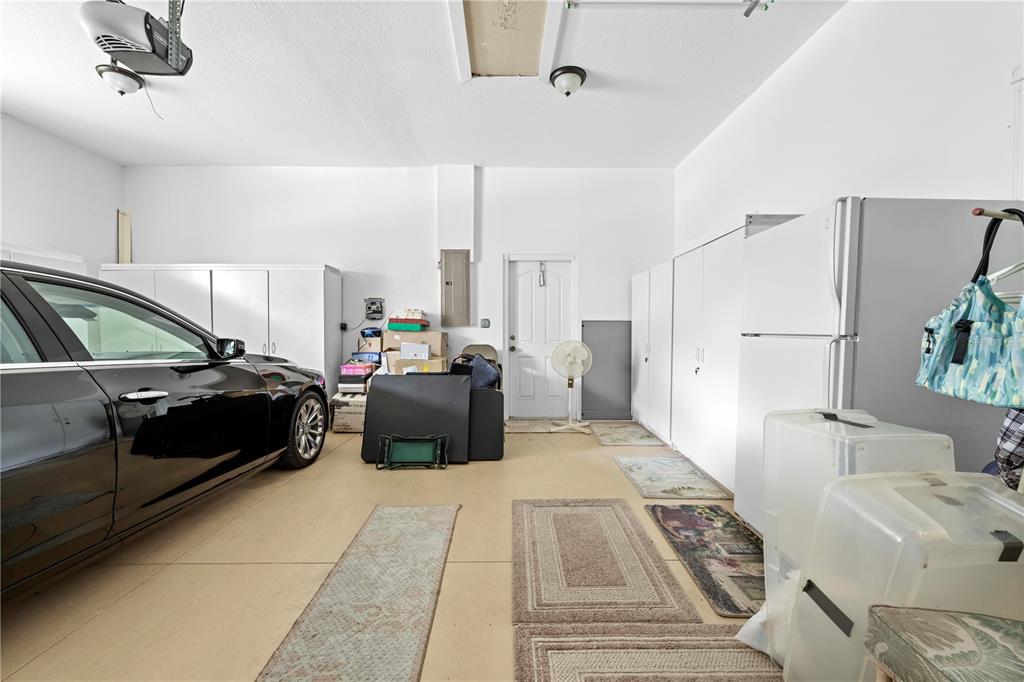 1245 Coble Road Spring Hill, FL 34608 - Photo 50 of 50 a hotel room with a bed and a couch