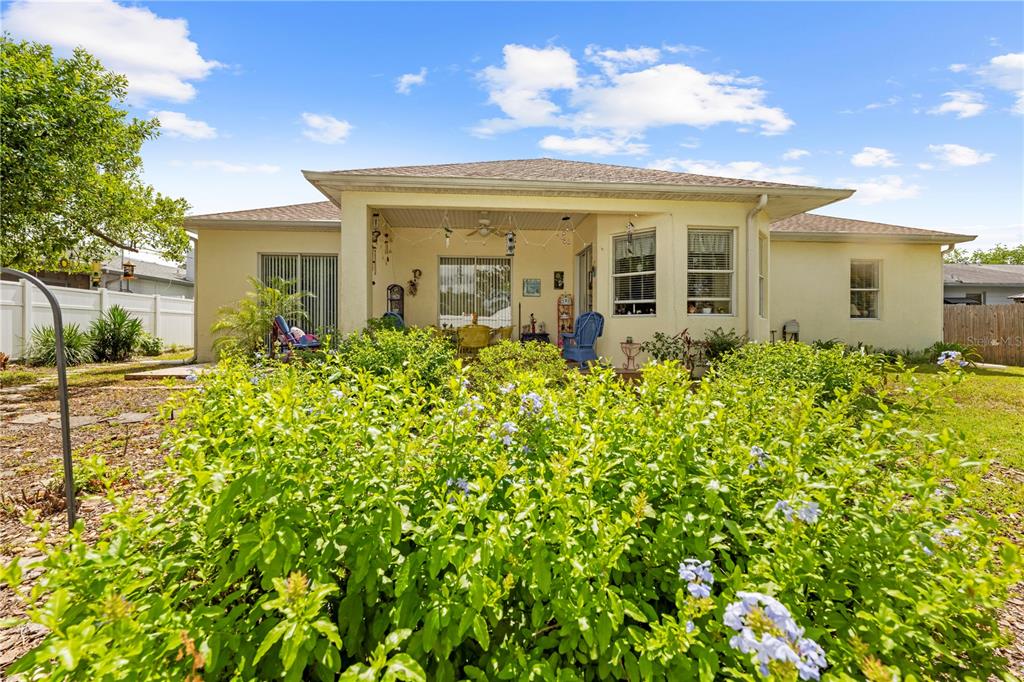 1245 Coble Road Spring Hill, FL 34608 - Photo 9 of 50 a view of a house with a flower garden