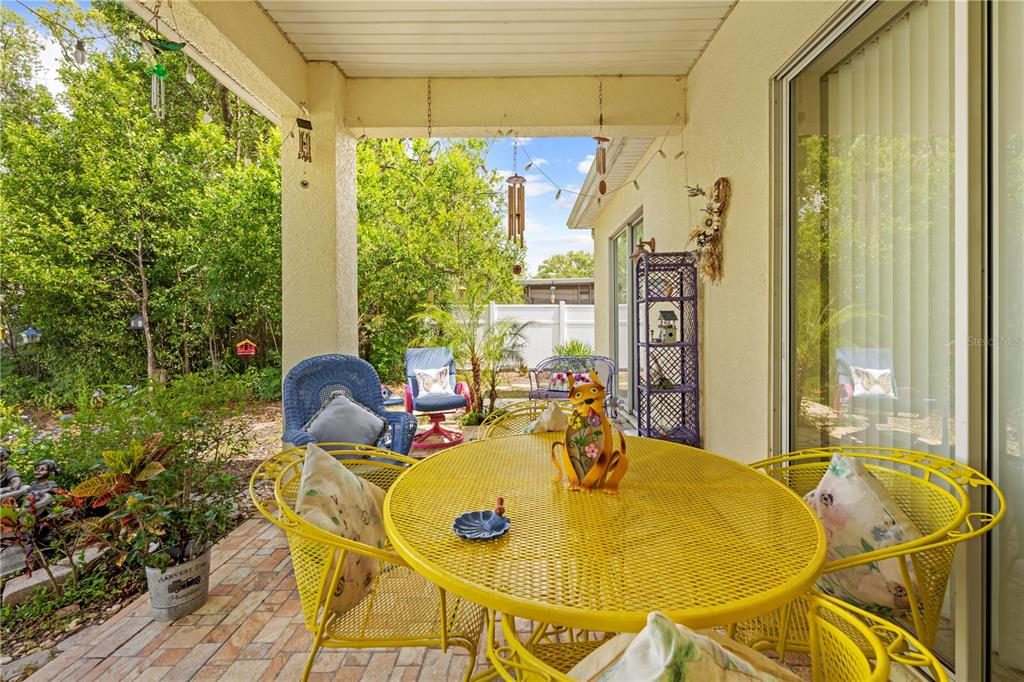 1245 Coble Road Spring Hill, FL 34608 - Photo 10 of 50 a view of an outdoor dining space with a table and chairs