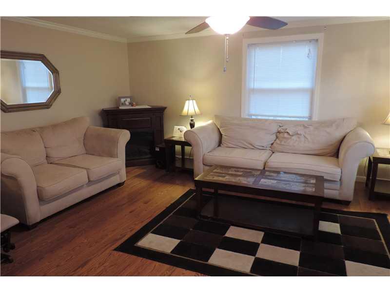 44 Profio Road McDonald, PA 15057 - Photo 3 of 24 Living Room. The spacious living room is freshly painted with new crown molding and gleaming hardwood floors.