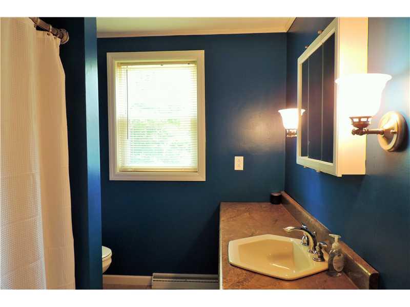 44 Profio Road McDonald, PA 15057 - Photo 8 of 24 Full Bath. The full bath features fresh paint and new ceramic tile floors with a large vanity.