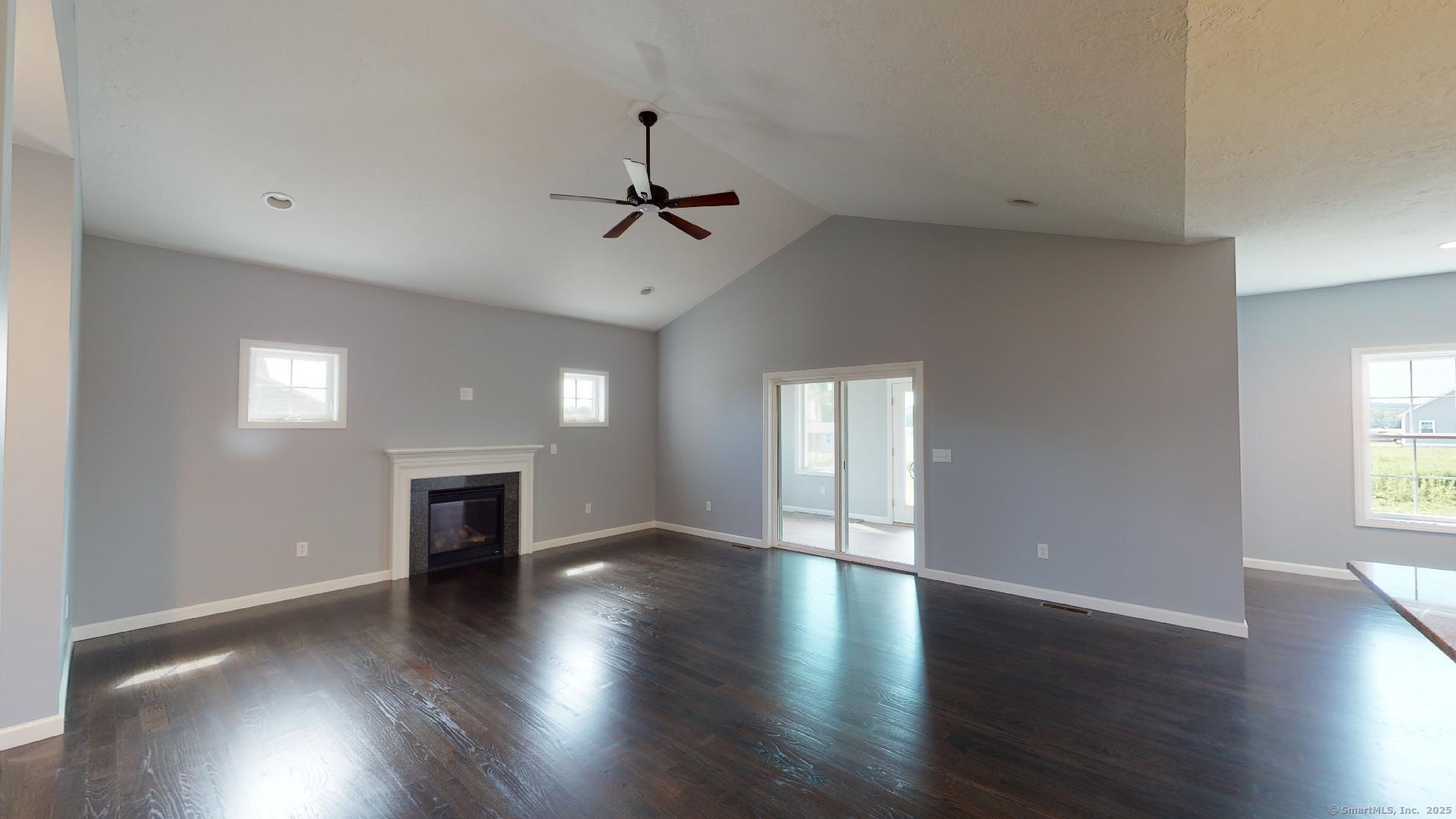 318 Capen Street Windsor, CT 06095 - Photo 15 of 37 a view of an empty room with window and wooden floor