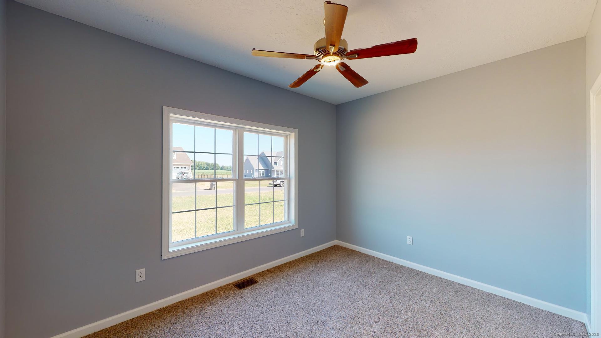 318 Capen Street Windsor, CT 06095 - Photo 26 of 37 an empty room with a window and a fan