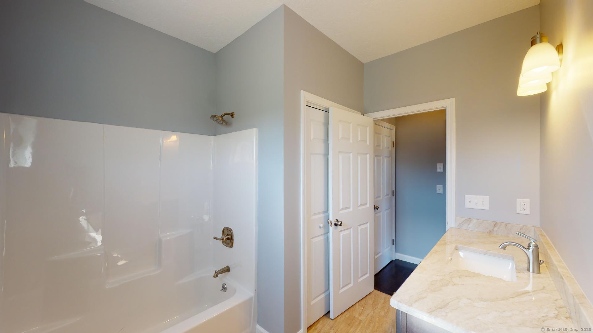 318 Capen Street Windsor, CT 06095 - Photo 30 of 37 a bathroom with a bathtub shower sink and toilet