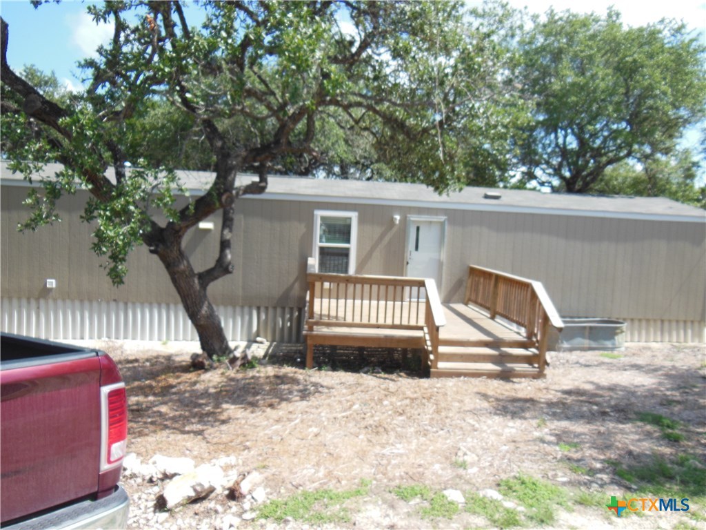 127 Quail Run Street Canyon Lake, TX 78133 - Photo 1 of 10 a view of porch with a bench