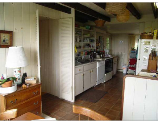 1935 Main Road Westport, MA 02791 - Photo 7 of 9 a kitchen with a sink and cabinets