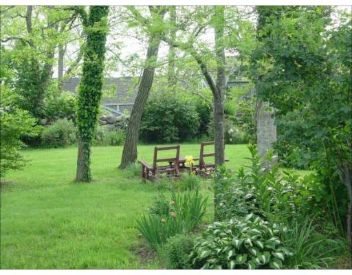 1935 Main Road Westport, MA 02791 - Photo 8 of 9 a garden with trees in the background