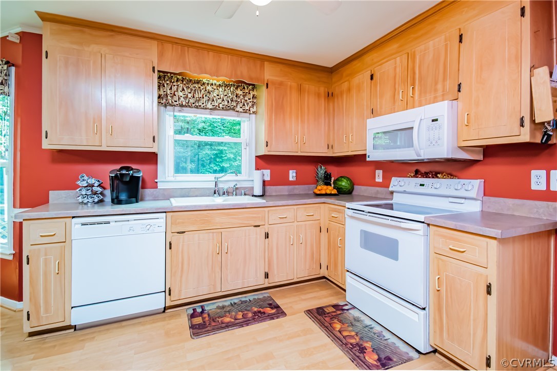5501 Chestnut Bluff Road Midlothian, VA 23112 - Photo 11 of 33 a kitchen with stainless steel appliances a stove a sink cabinets and a window