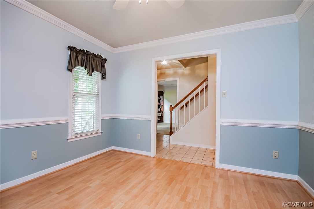 5501 Chestnut Bluff Road Midlothian, VA 23112 - Photo 14 of 33 a view of an empty room with wooden floor and a window