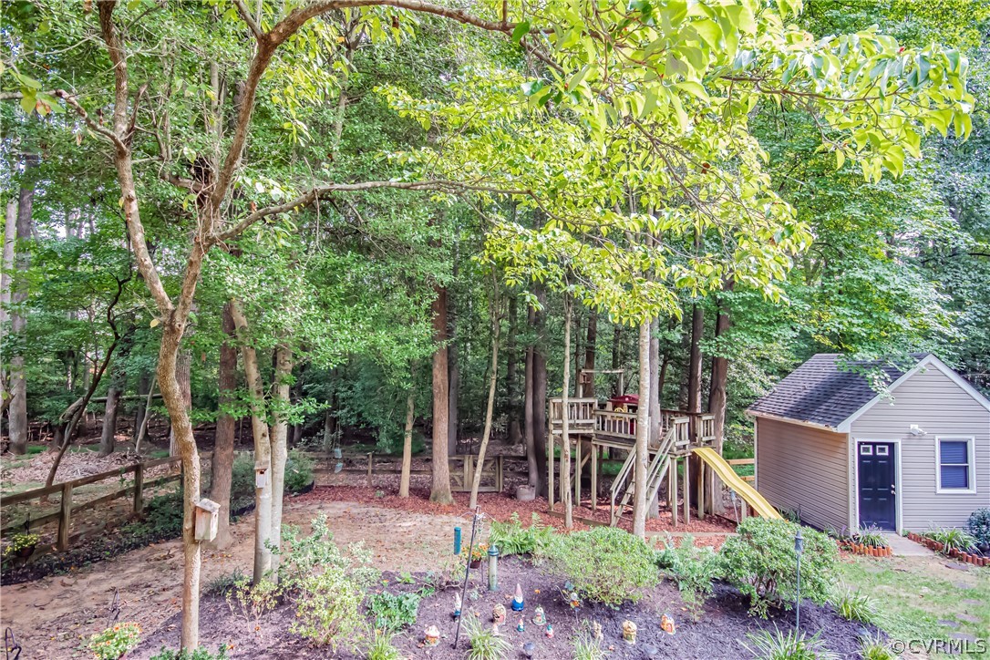 5501 Chestnut Bluff Road Midlothian, VA 23112 - Photo 33 of 33 a view of a backyard with garden
