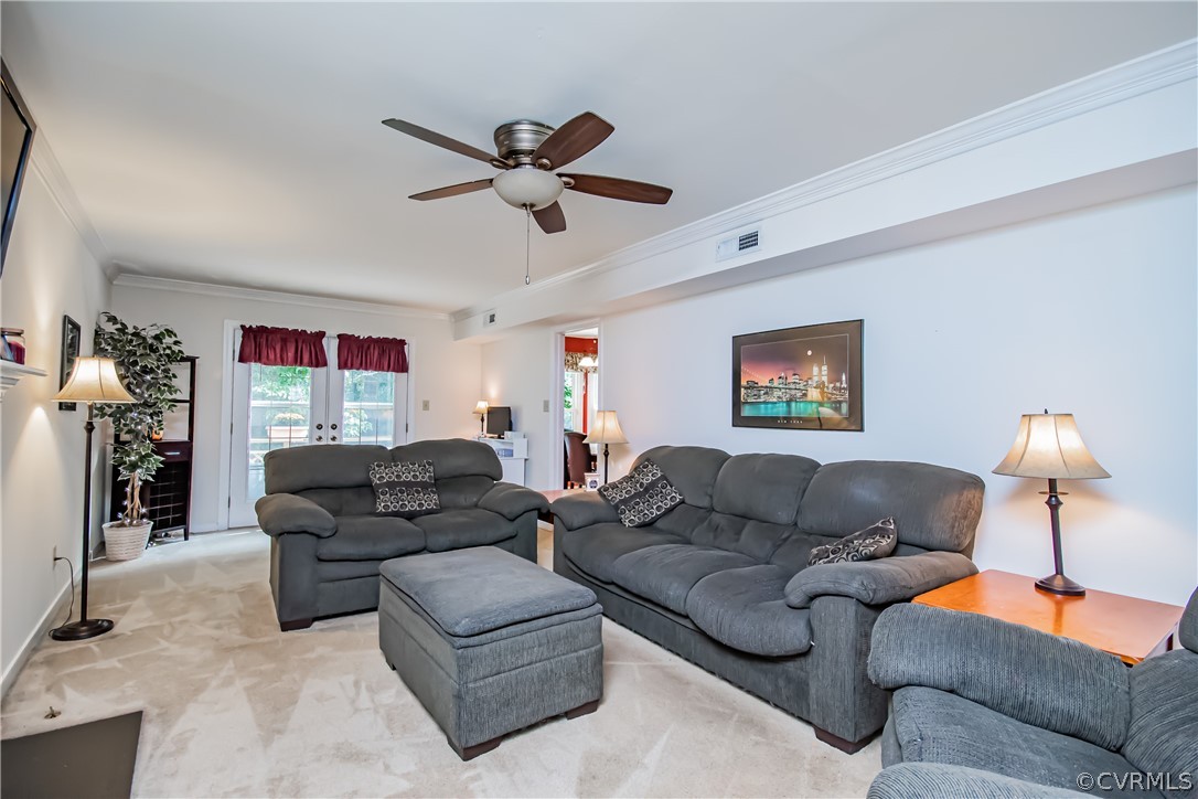 5501 Chestnut Bluff Road Midlothian, VA 23112 - Photo 7 of 33 a living room with furniture a ceiling fan and a window