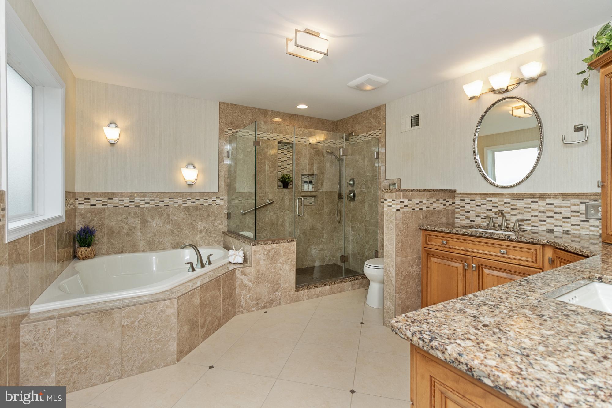 4116 Mt Carmel Road Upperco, MD 21155 - Photo 27 of 60 Primary bath glass enclosed shower and bench