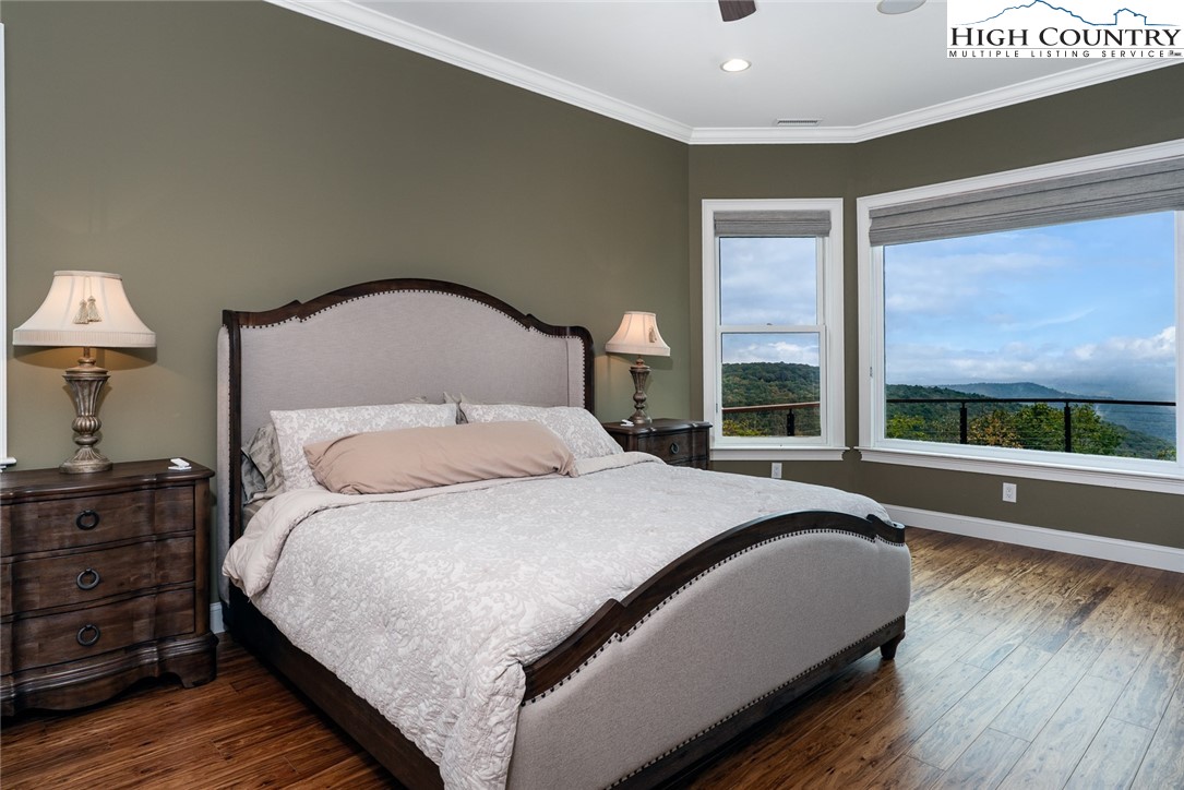 175 Boone Ridge Lane Boone, NC 28607 - Photo 26 of 47 a bedroom with a large bed and a large window