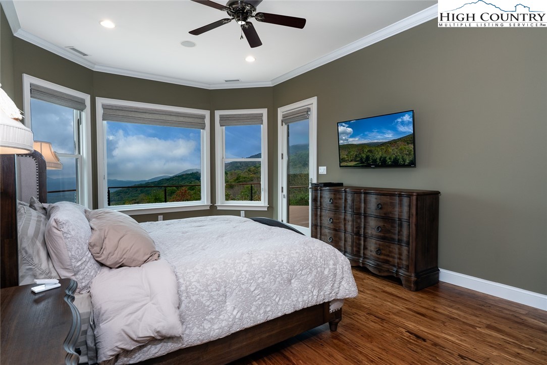 175 Boone Ridge Lane Boone, NC 28607 - Photo 27 of 47 a bedroom with a bed and a flat screen tv