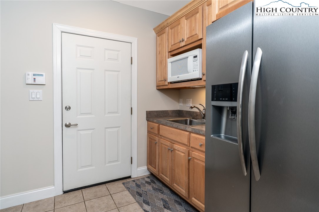 175 Boone Ridge Lane Boone, NC 28607 - Photo 44 of 47 a kitchen with stainless steel appliances granite countertop a refrigerator and a sink
