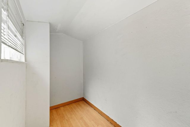 a view of room with window and ceiling fan