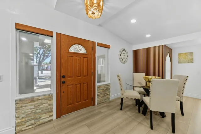 a kitchen with kitchen island a stove a sink and a refrigerator