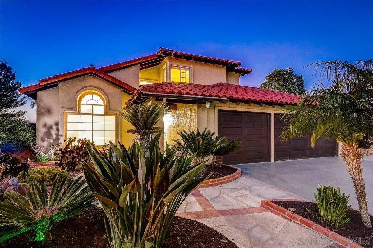 5080 Frazee Road Oceanside, CA 92057 - Photo 1 of 44 a view of a house with a flower garden