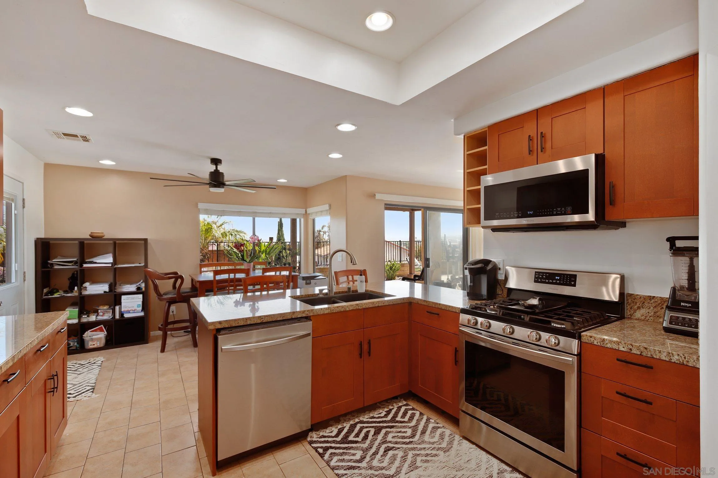 5080 Frazee Road Oceanside, CA 92057 - Photo 12 of 44 a kitchen with lots of counter top space and appliances