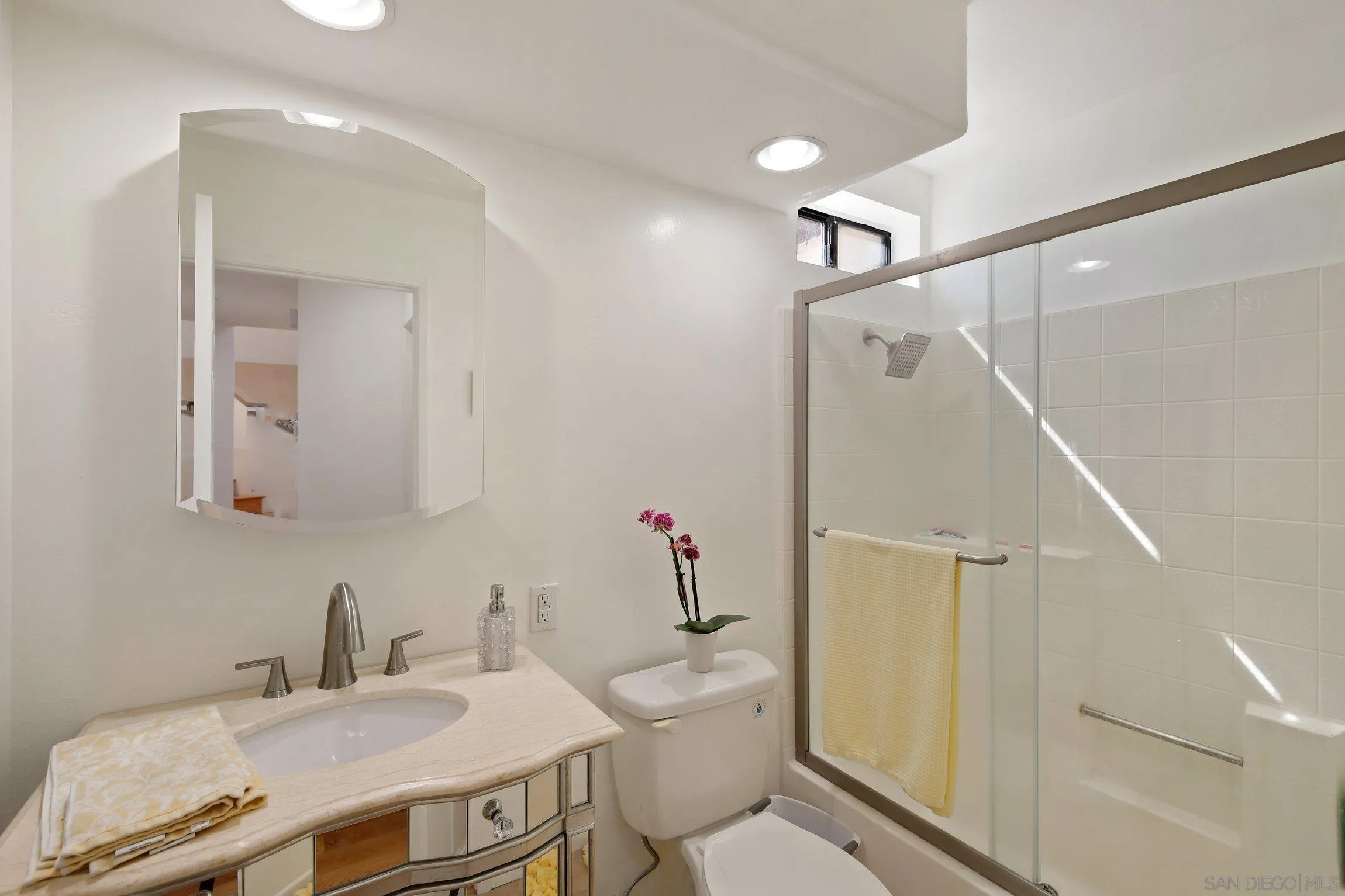 5080 Frazee Road Oceanside, CA 92057 - Photo 15 of 44 a bathroom with a sink toilet and shower