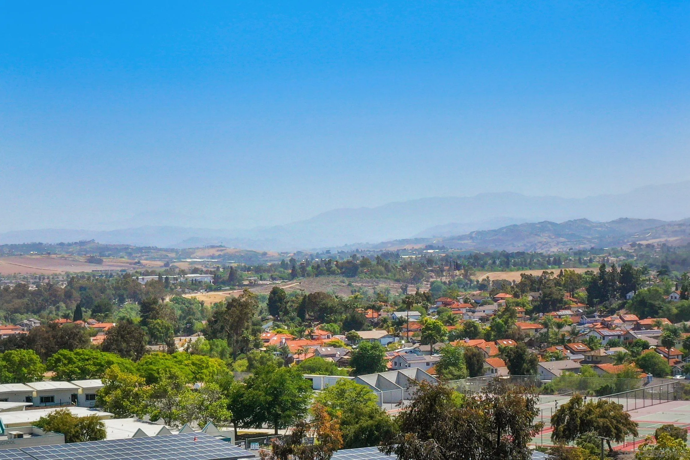 5080 Frazee Road Oceanside, CA 92057 - Photo 19 of 44 an aerial view of residential house with outdoor space
