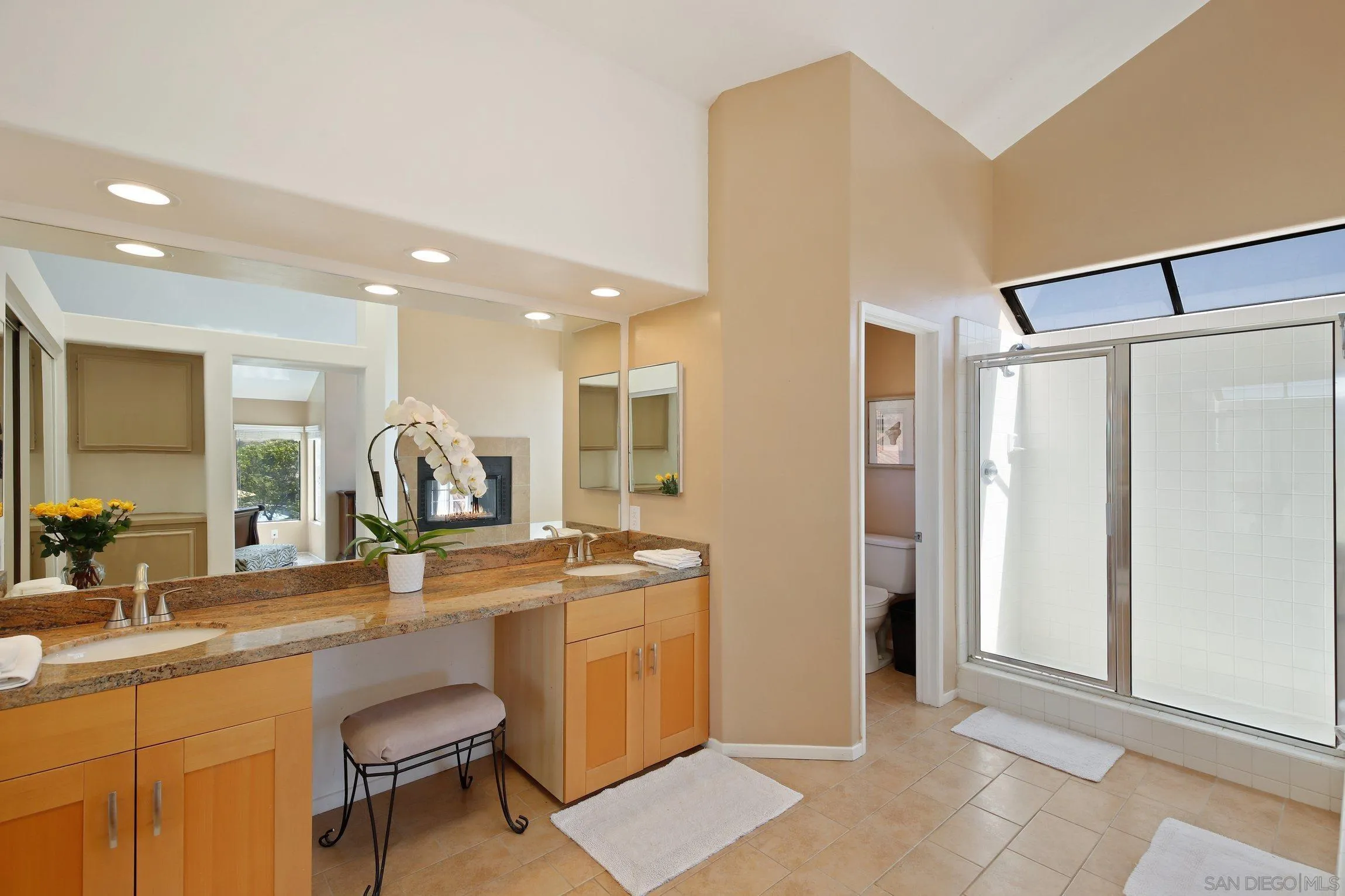 5080 Frazee Road Oceanside, CA 92057 - Photo 20 of 44 a room with stainless steel appliances kitchen island granite countertop a refrigerator and a sink